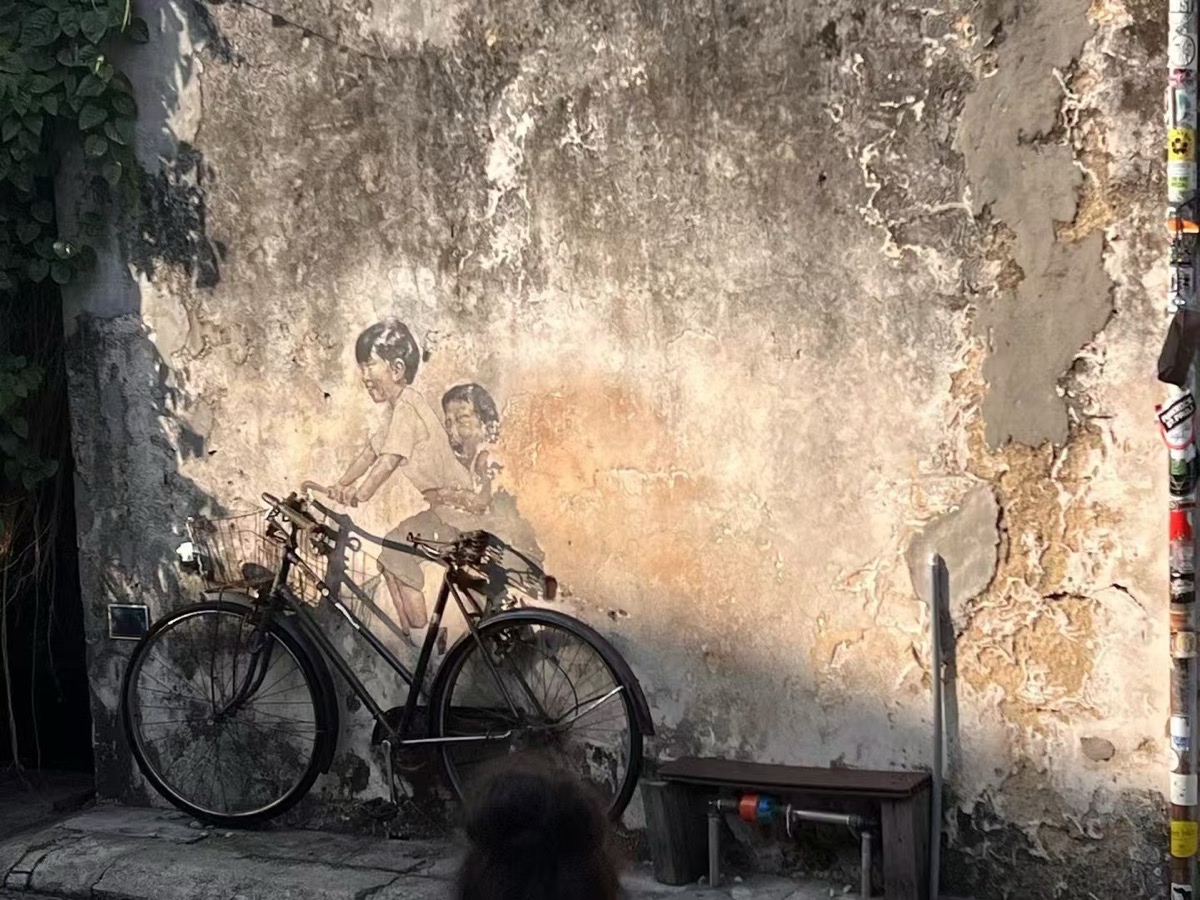 The famous "Children on a Bicycle" mural in George Town